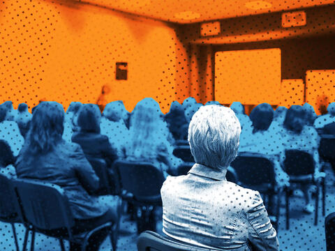 people sitting in a conference hall