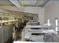 photo of a correctional facility with bunkbed-style sleeping arrangements
