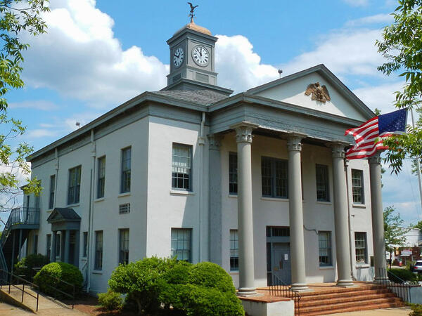 Marion county courthouse with U S flag on a flagpole in front